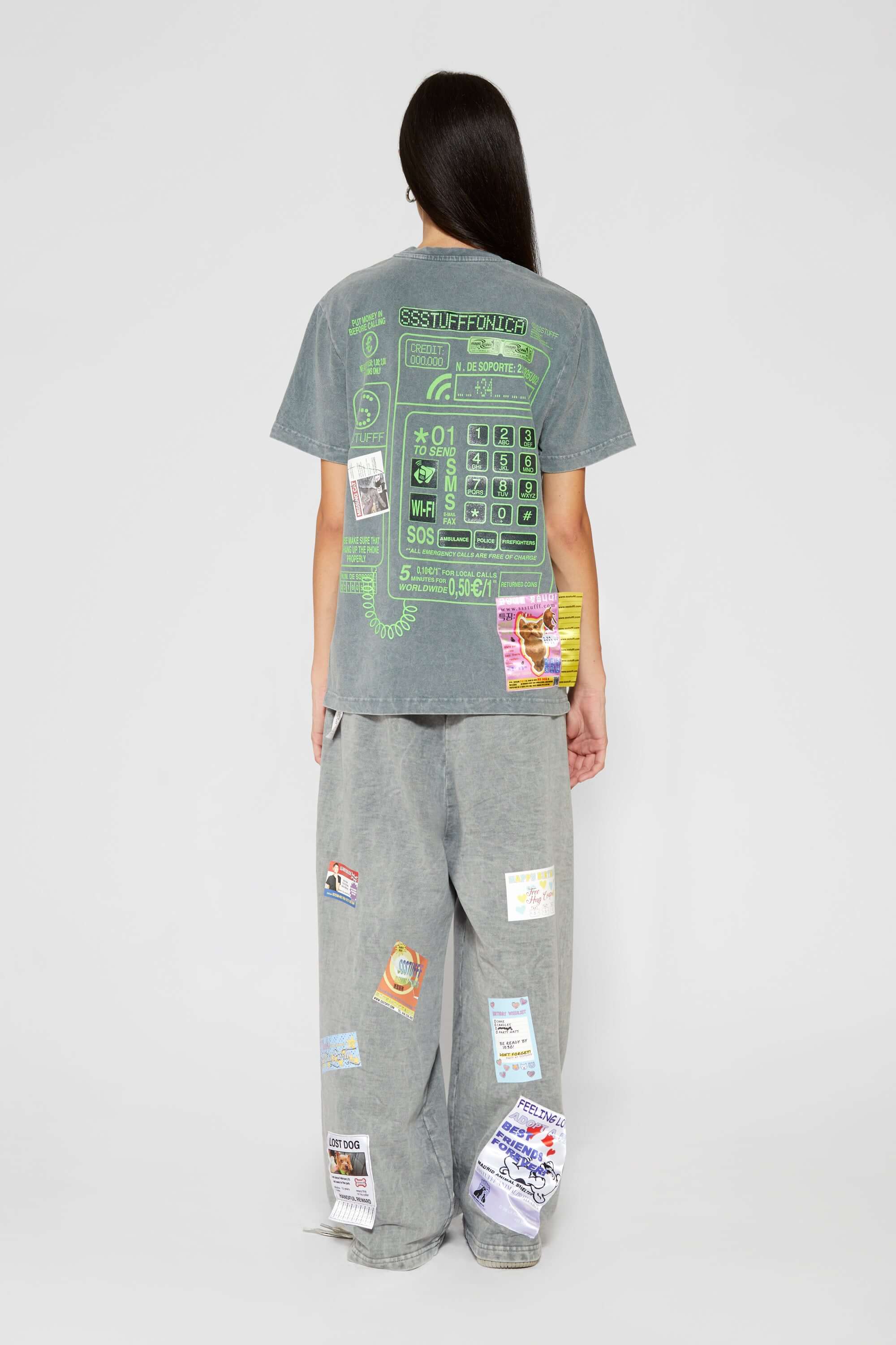 Hand-sewn grey t-shirt with Spanish telephone booth design featuring screen print, silicone print, jacquards, and vinyl details
