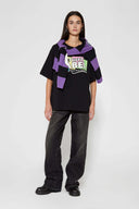 Black t-shirt with microphone graphic featuring mesh fabric detail on microphone top