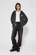 Vintage black zip-up hoodie with LED-lit TPU cat logo on chest and hand-sewn missing cat patches on back