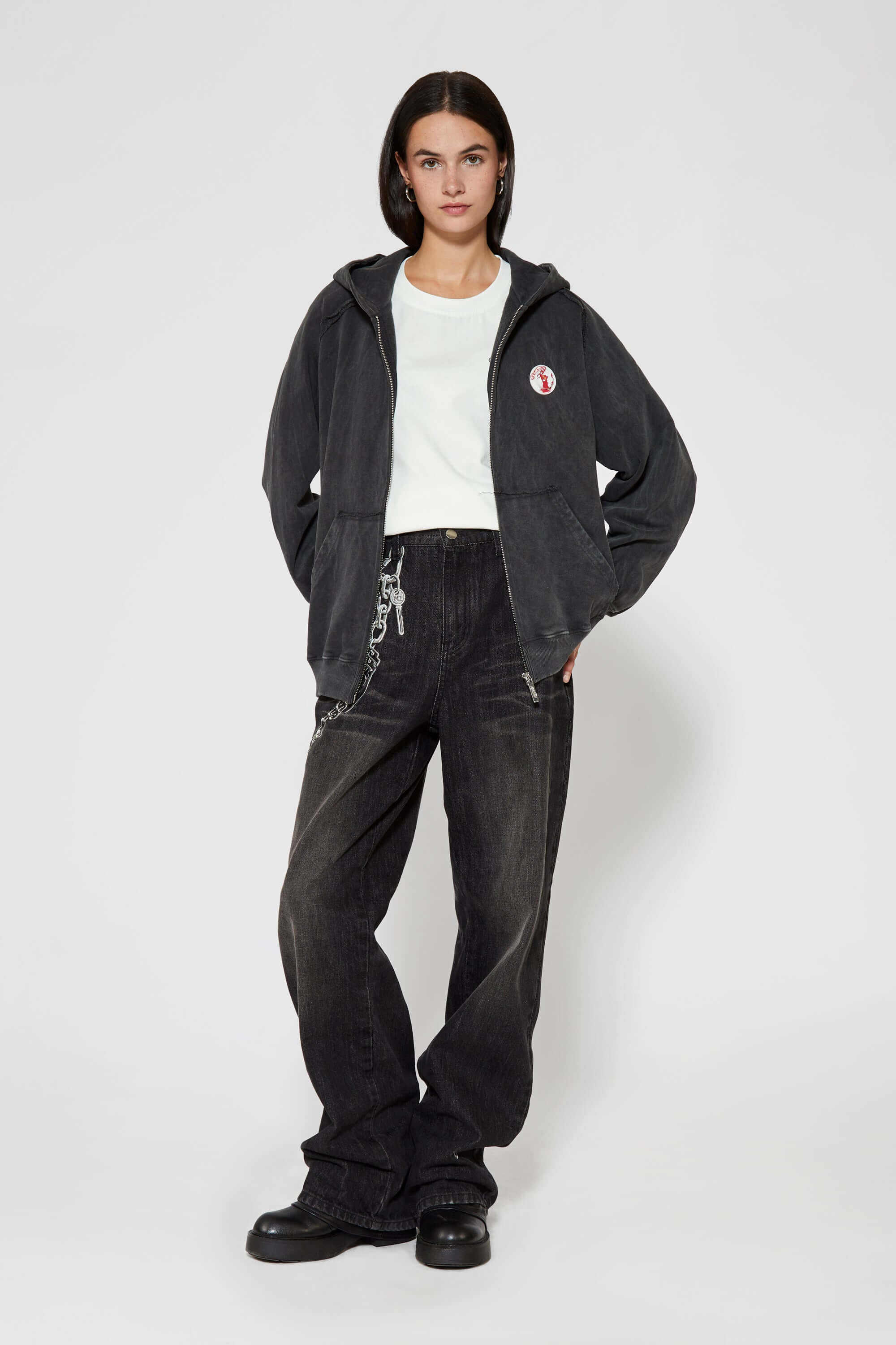 Vintage black zip-up hoodie with LED-lit TPU cat logo on chest and hand-sewn missing cat patches on back