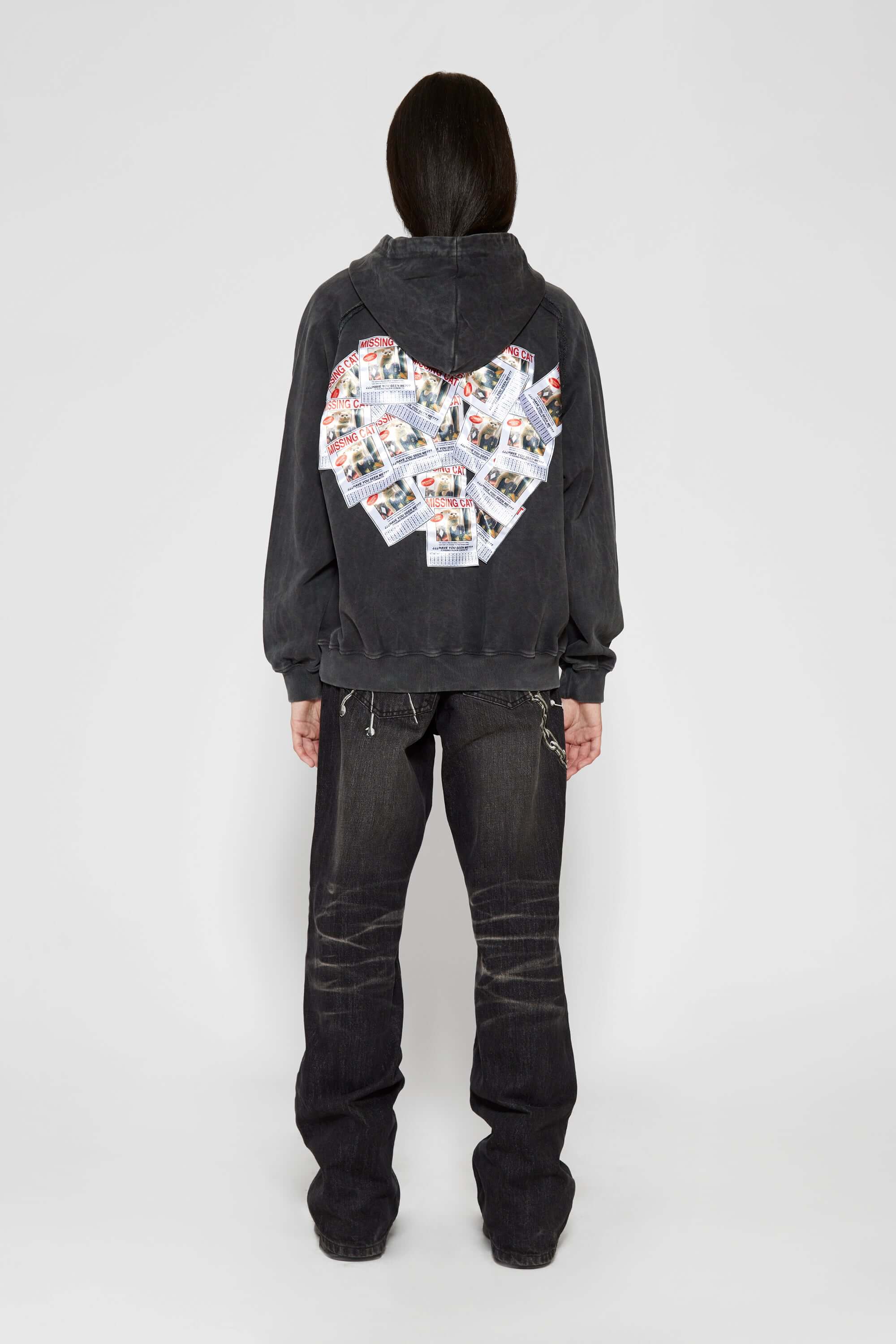 Vintage black zip-up hoodie with LED-lit TPU cat logo on chest and hand-sewn missing cat patches on back