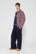 Denim-effect sweatpants with gothic STF embroidery, custom SSSTUFFF metal button, and leather patch with functional compass