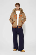 Denim-effect sweatpants with gothic STF embroidery, custom SSSTUFFF metal button, and leather patch with functional compass