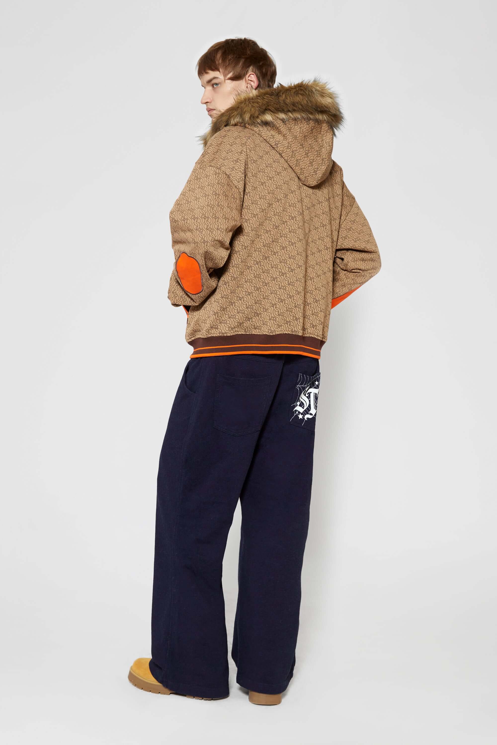 Denim-effect sweatpants with gothic STF embroidery, custom SSSTUFFF metal button, and leather patch with functional compass