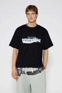 Black t-shirt with piano key graphic featuring raised puff print on white keys and SSSTUFFF Rhythm text