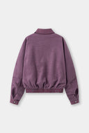 Reversible jacket with burgundy and grey micro-check pattern on one side and purple fleece on reverse