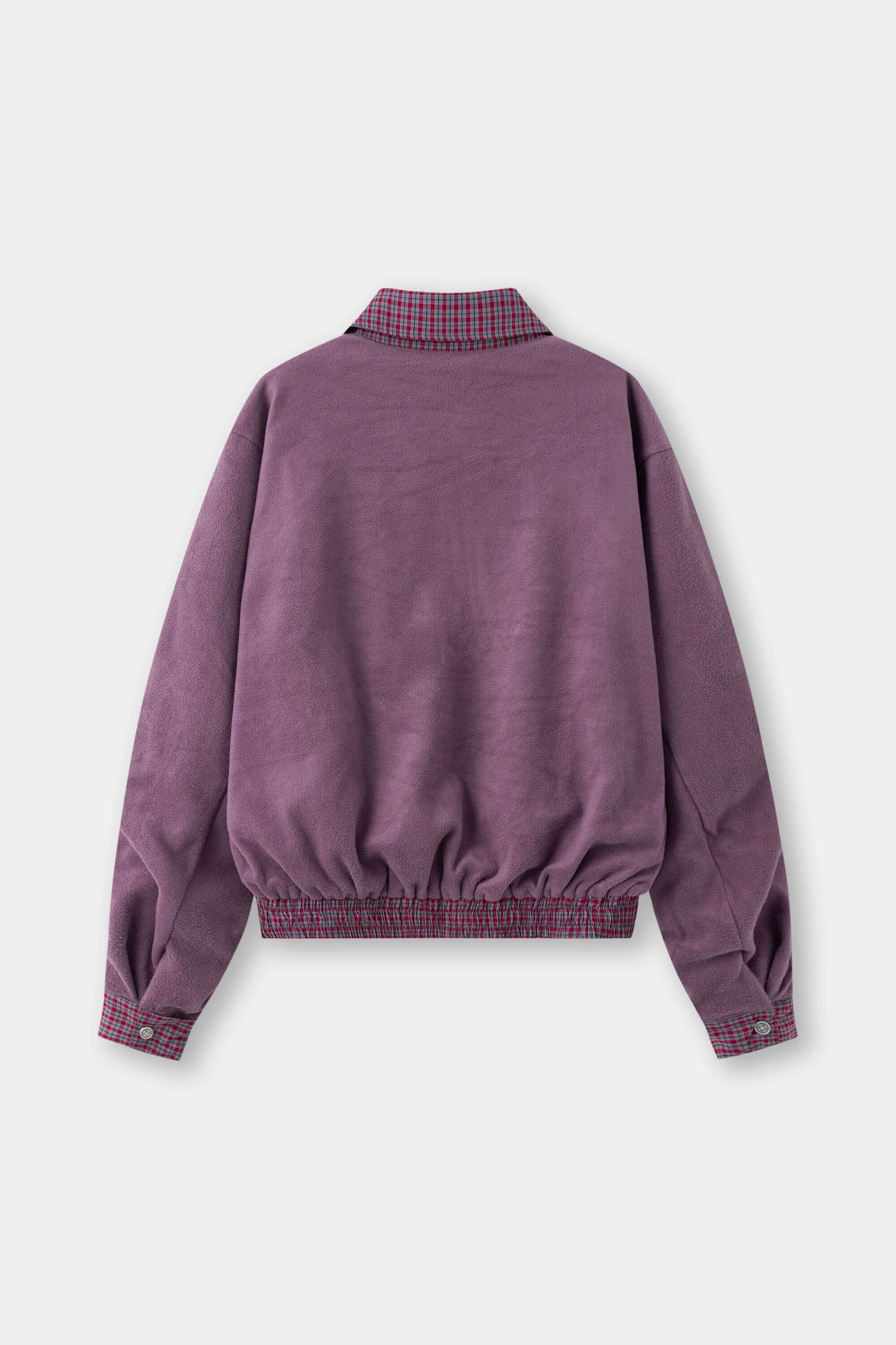 Reversible jacket with burgundy and grey micro-check pattern on one side and purple fleece on reverse