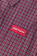 Reversible jacket with burgundy and grey micro-check pattern on one side and purple fleece on reverse