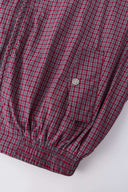 Reversible jacket with burgundy and grey micro-check pattern on one side and purple fleece on reverse