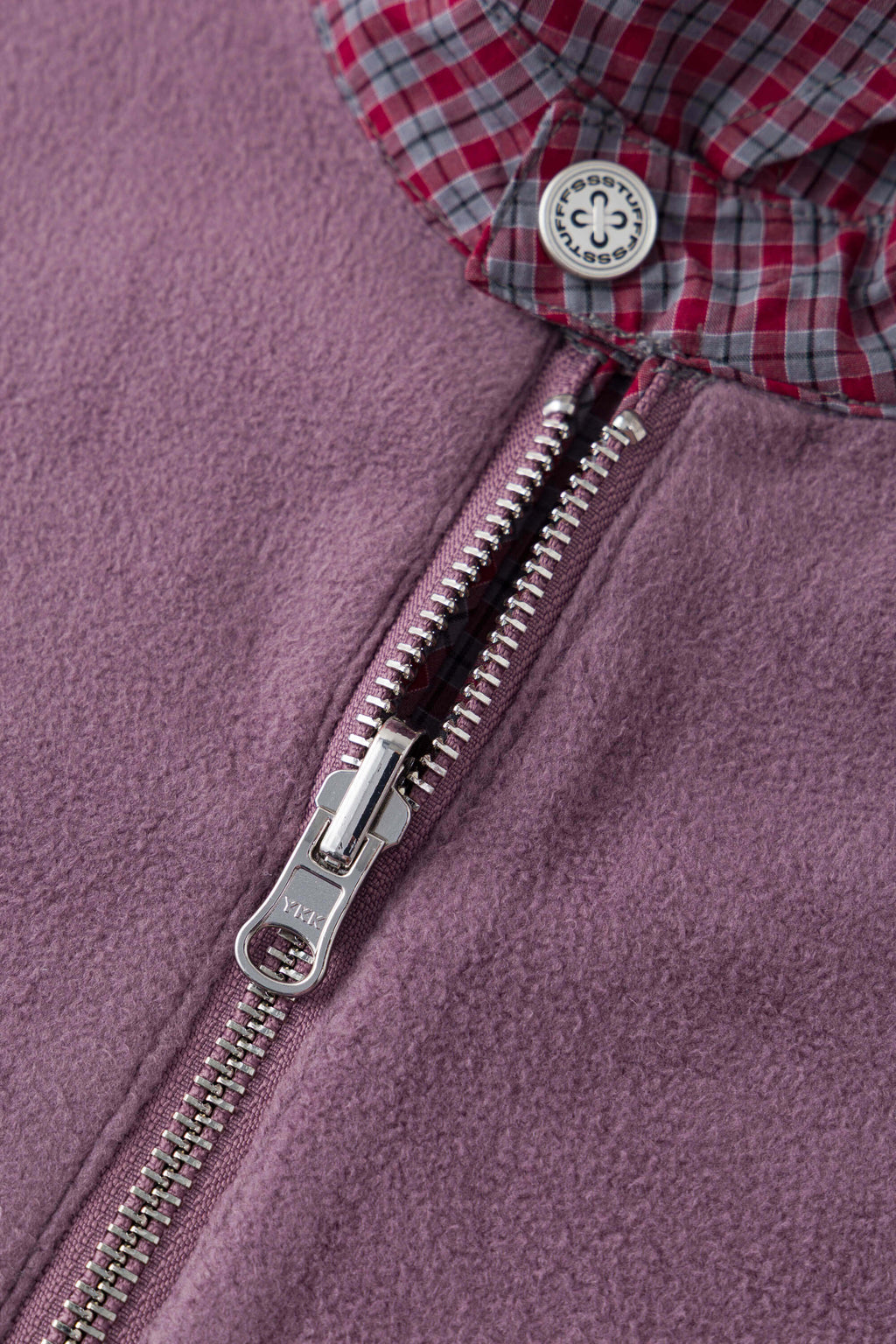 Reversible jacket with burgundy and grey micro-check pattern on one side and purple fleece on reverse