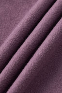 Reversible jacket with burgundy and grey micro-check pattern on one side and purple fleece on reverse