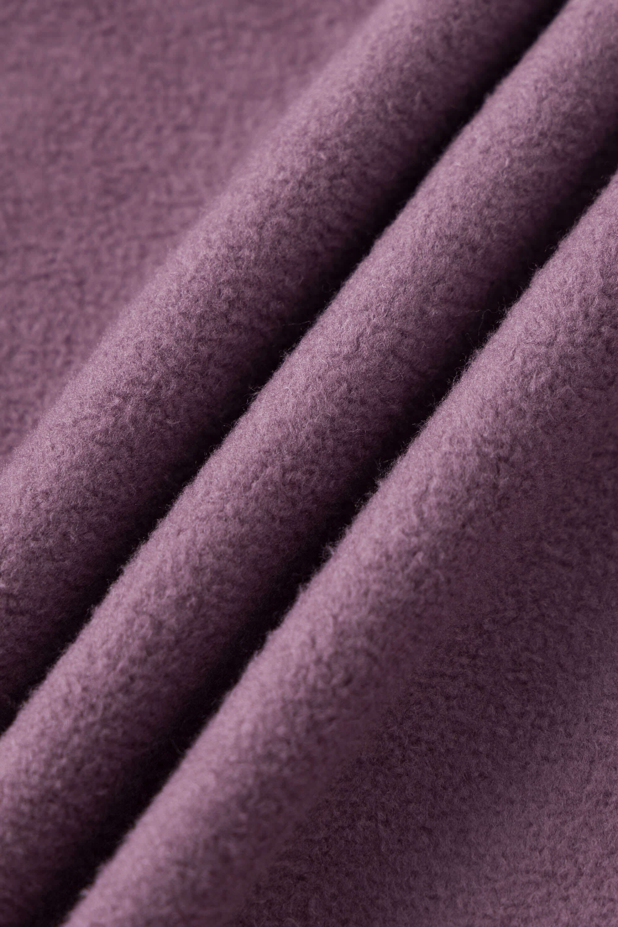 Reversible jacket with burgundy and grey micro-check pattern on one side and purple fleece on reverse