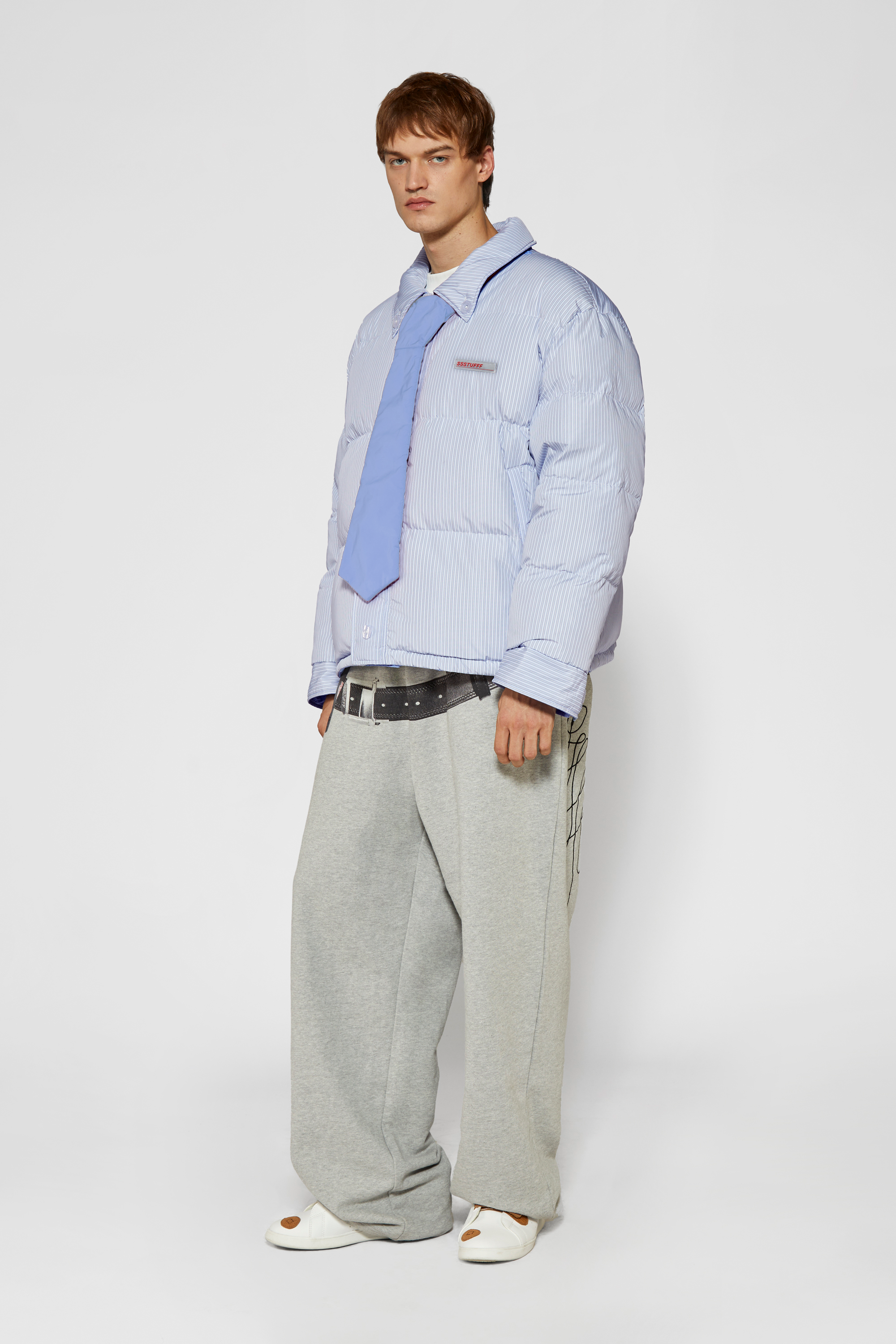Reversible down puffer jacket with pinstriped shirt side and pastel blue side, includes two detachable ties