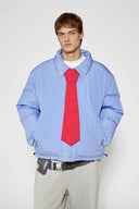Reversible down puffer jacket with pinstriped shirt side and pastel blue side, includes two detachable ties