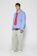 Reversible down puffer jacket with pinstriped shirt side and pastel blue side, includes two detachable ties