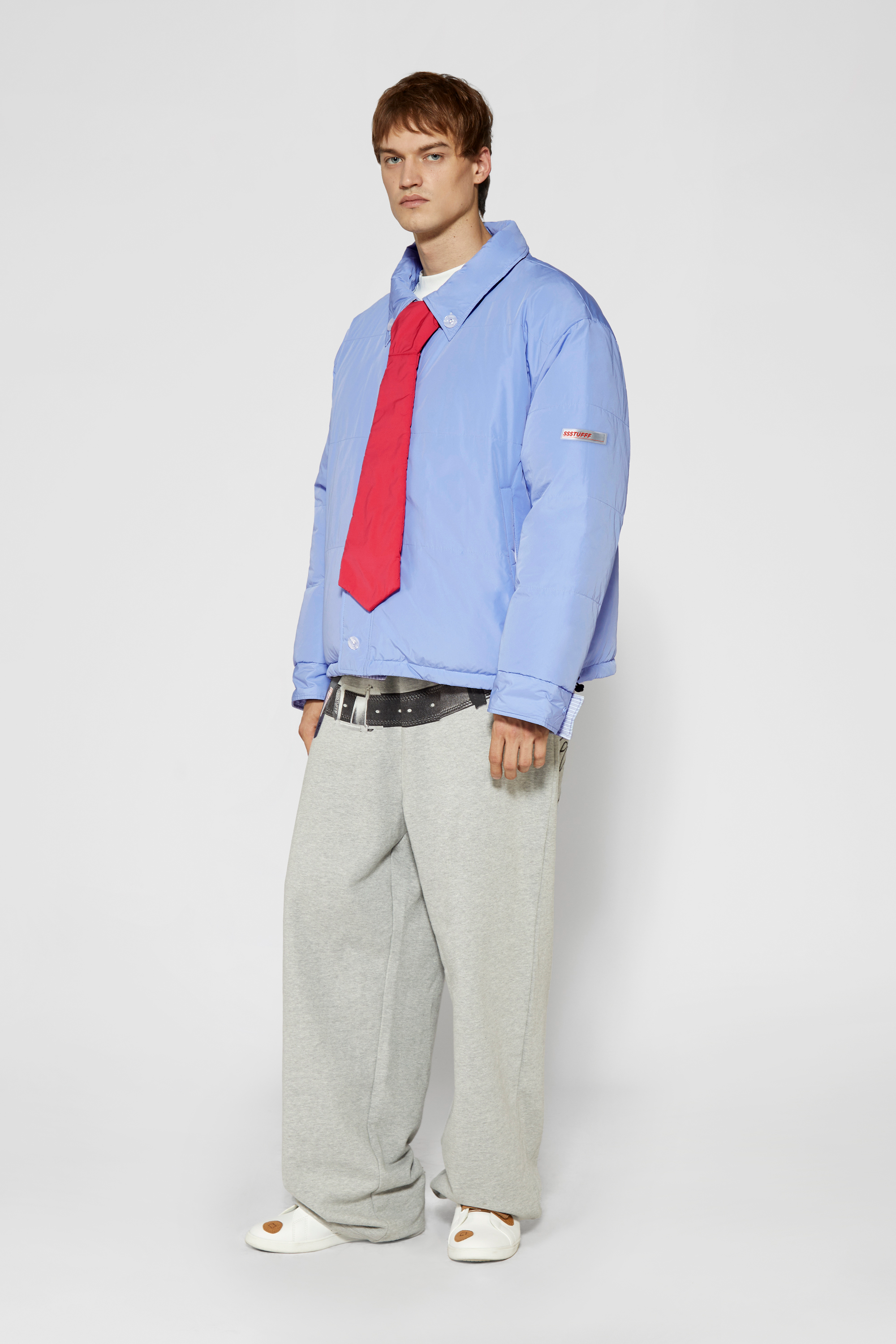 Reversible down puffer jacket with pinstriped shirt side and pastel blue side, includes two detachable ties