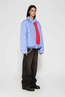 Reversible down puffer jacket with pinstriped shirt side and pastel blue side, includes two detachable ties