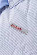 Reversible down puffer jacket with pinstriped shirt side and pastel blue side, includes two detachable ties