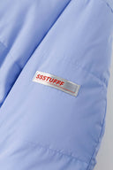 Reversible down puffer jacket with pinstriped shirt side and pastel blue side, includes two detachable ties