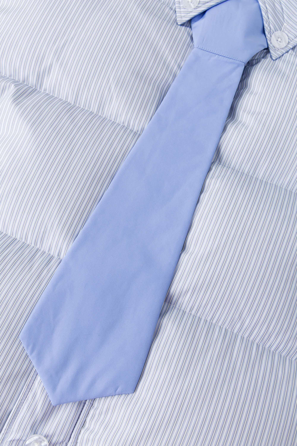 Reversible down puffer jacket with pinstriped shirt side and pastel blue side, includes two detachable ties