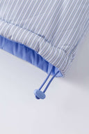 Reversible down puffer jacket with pinstriped shirt side and pastel blue side, includes two detachable ties