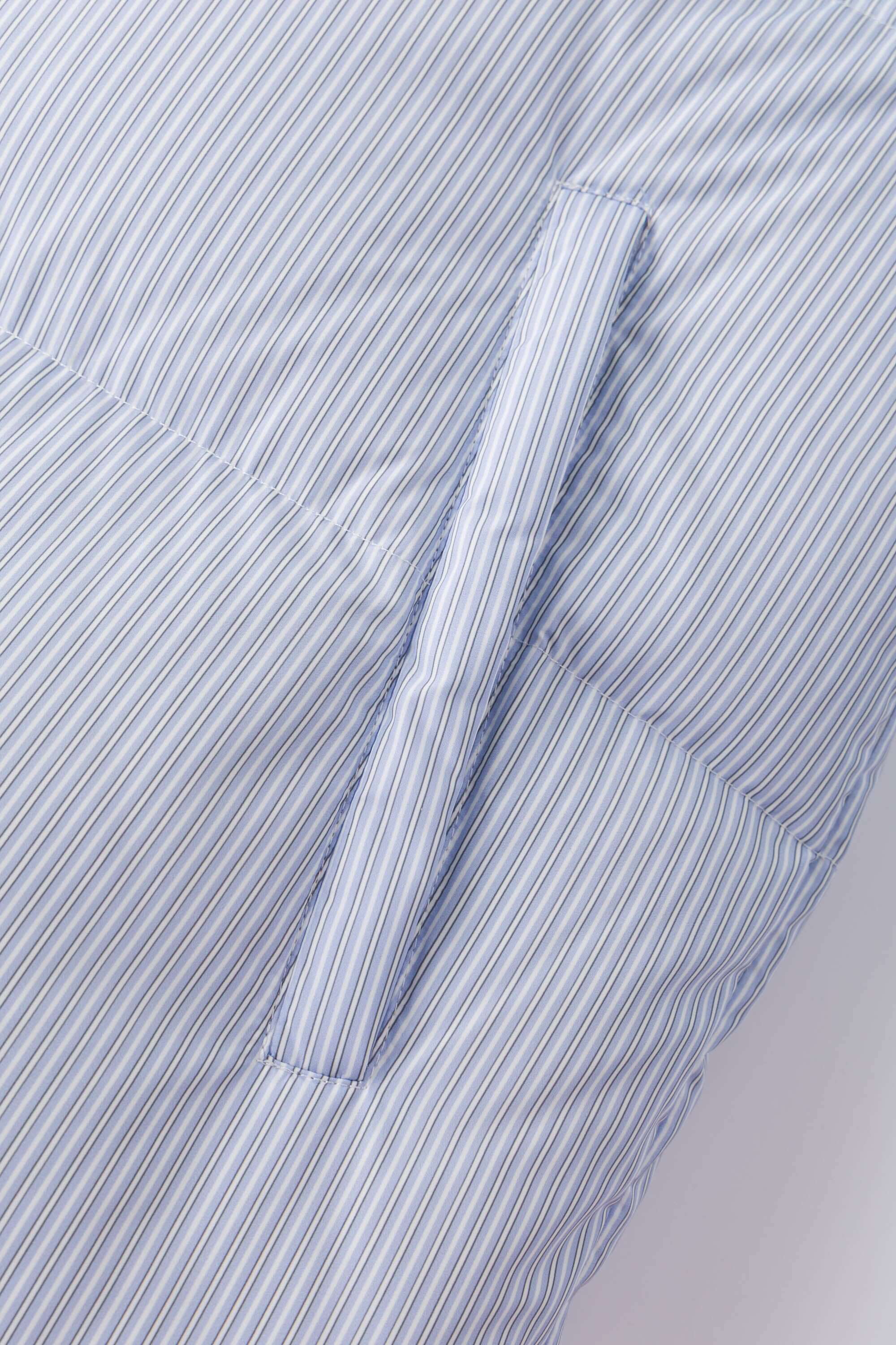 Reversible down puffer jacket with pinstriped shirt side and pastel blue side, includes two detachable ties