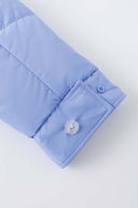 Reversible down puffer jacket with pinstriped shirt side and pastel blue side, includes two detachable ties