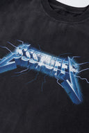 Stone-washed t-shirt with vintage lightning logo inspired by 80s rock bands