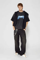 Stone-washed t-shirt with vintage lightning logo inspired by 80s rock bands