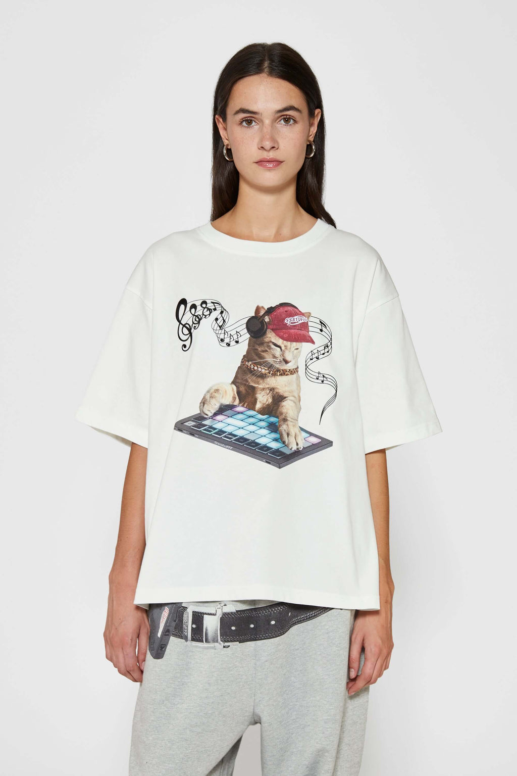 White t-shirt with embroidered SSSTUFFF logo and silicone-printed musical notes