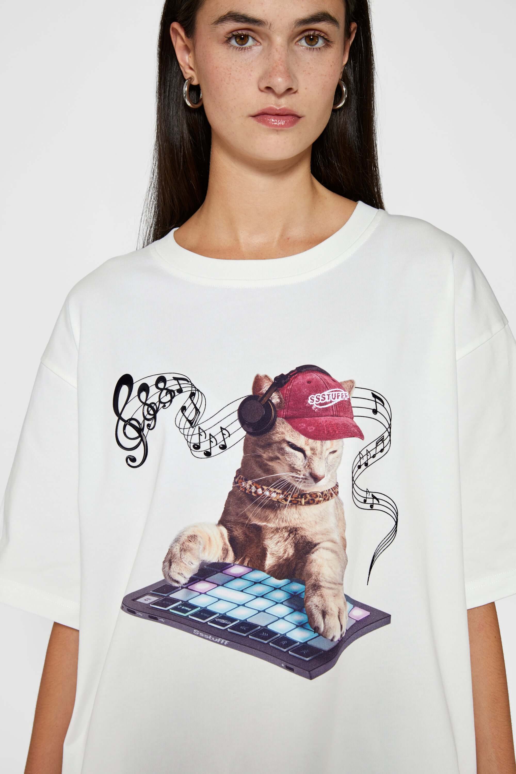 White t-shirt with embroidered SSSTUFFF logo and silicone-printed musical notes