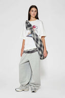 White t-shirt with embroidered SSSTUFFF logo and silicone-printed musical notes