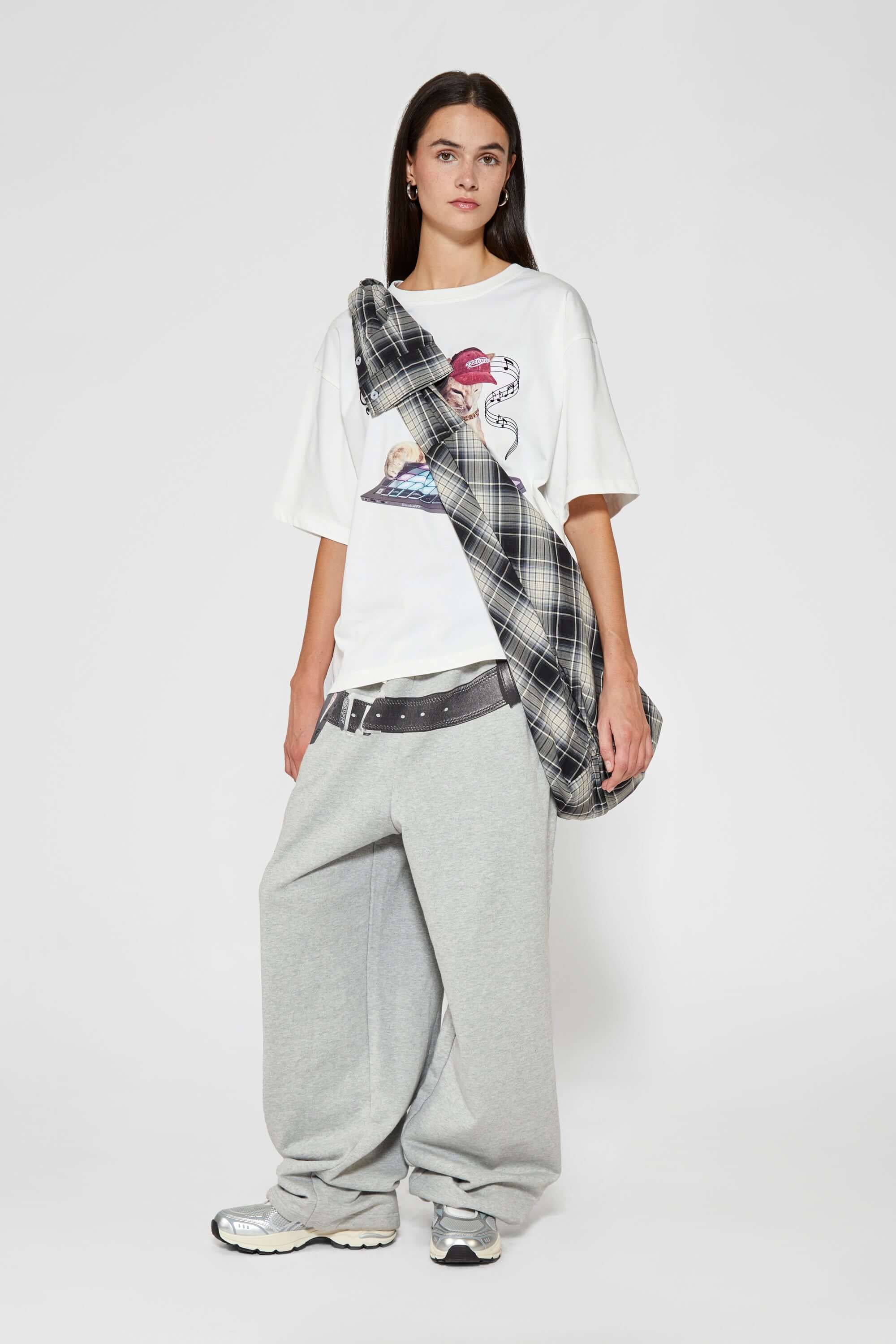 White t-shirt with embroidered SSSTUFFF logo and silicone-printed musical notes