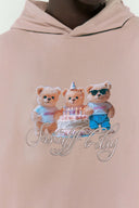 Beige hooded long sleeve t-shirt with three bears graphic in digital print and embroidery