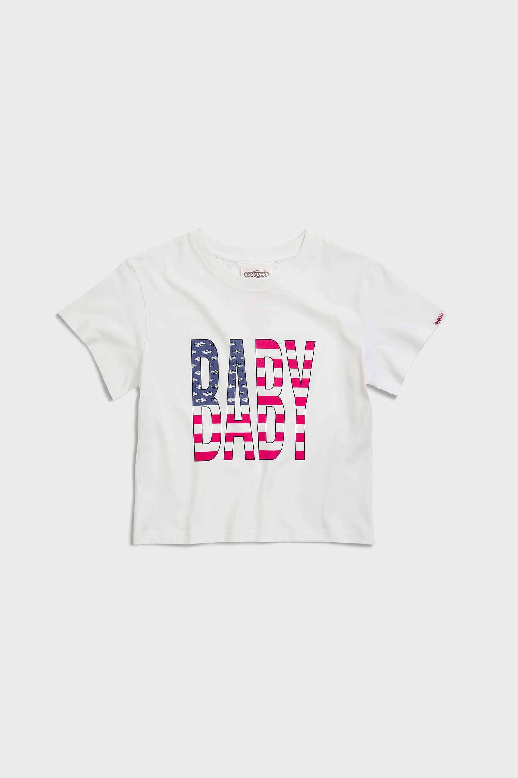 White crew neck t-shirt with the text 'BABY' digitally printed in bold letters with the American flag 