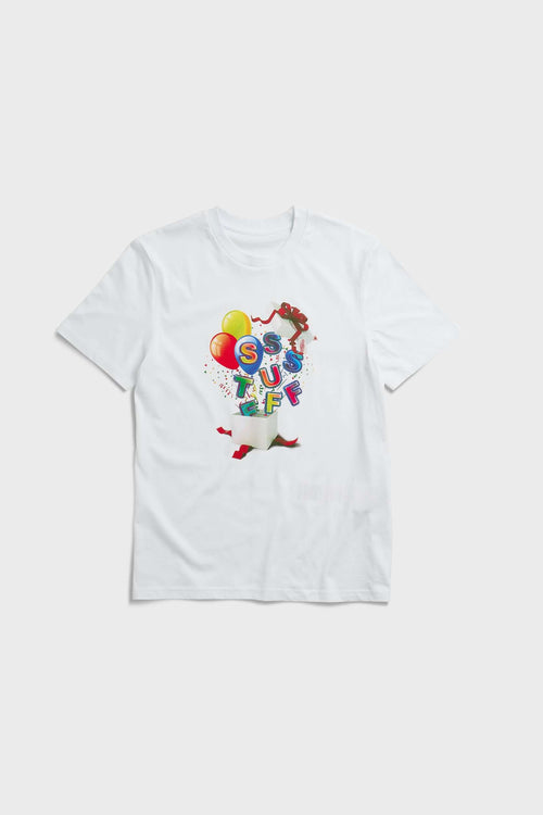 White t-shirt with colorful birthday balloons and gift graphic in CMYK screenprint"