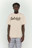 Beige t-shirt with 3D silicone buttercream-style SSSTUFFF logo graphic