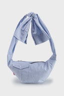 Blue striped croissant-shaped mini bag with shirt texture and adjustable sleeve handles for shoulder or crossbody wear