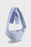 Blue striped croissant-shaped mini bag with shirt texture and adjustable sleeve handles for shoulder or crossbody wear