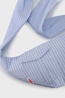 Blue striped croissant-shaped mini bag with shirt texture and adjustable sleeve handles for shoulder or crossbody wear