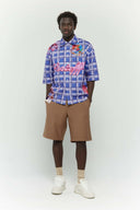 Blue checkered shirt  with colorful cake stain digital print inspired by birthday parties