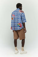 Blue checkered shirt  with colorful cake stain digital print inspired by birthday parties