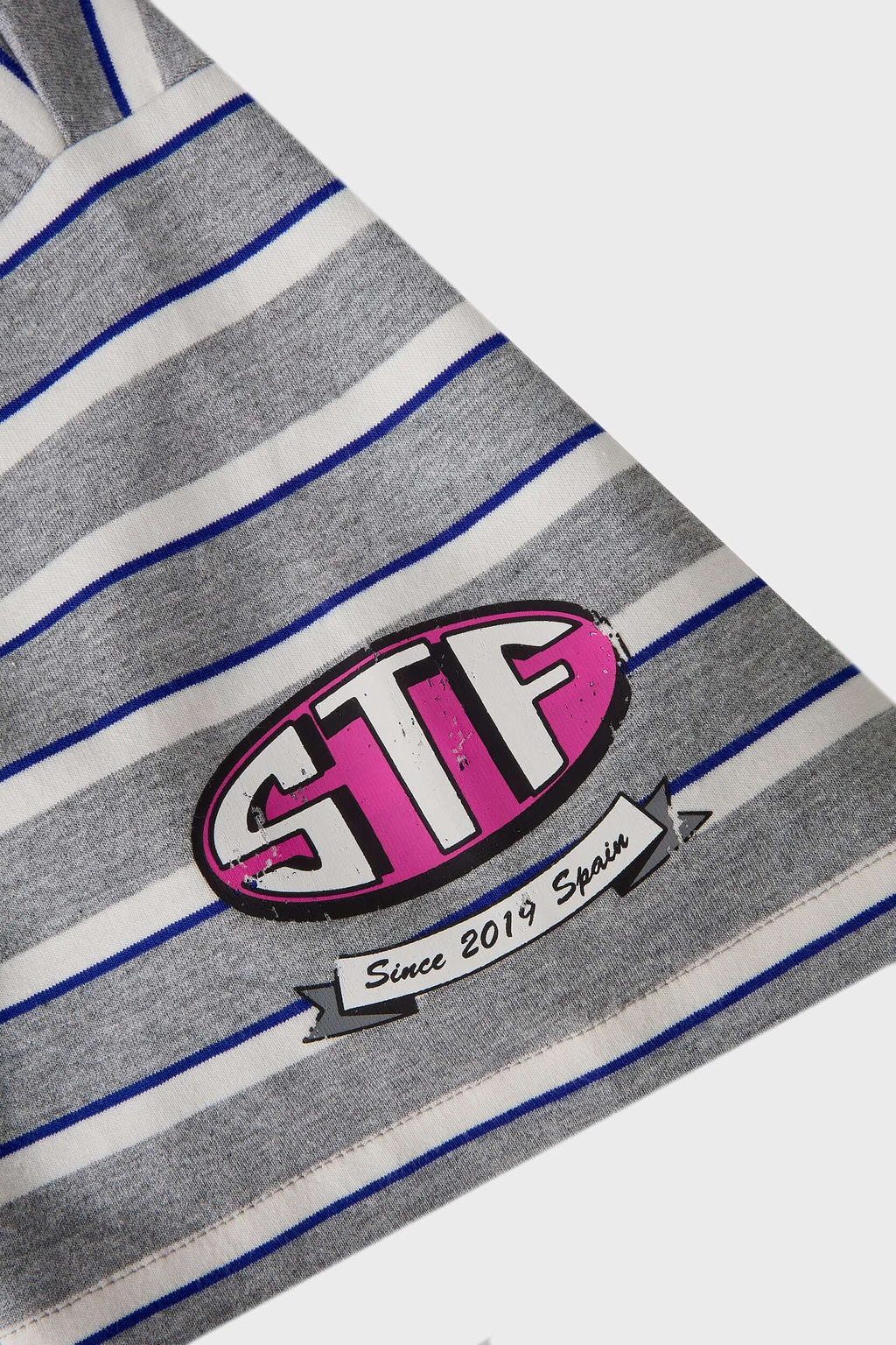 Grey striped polo shirt with embroidery, PVC, and screenprint graphics inspired by retro birthday party style