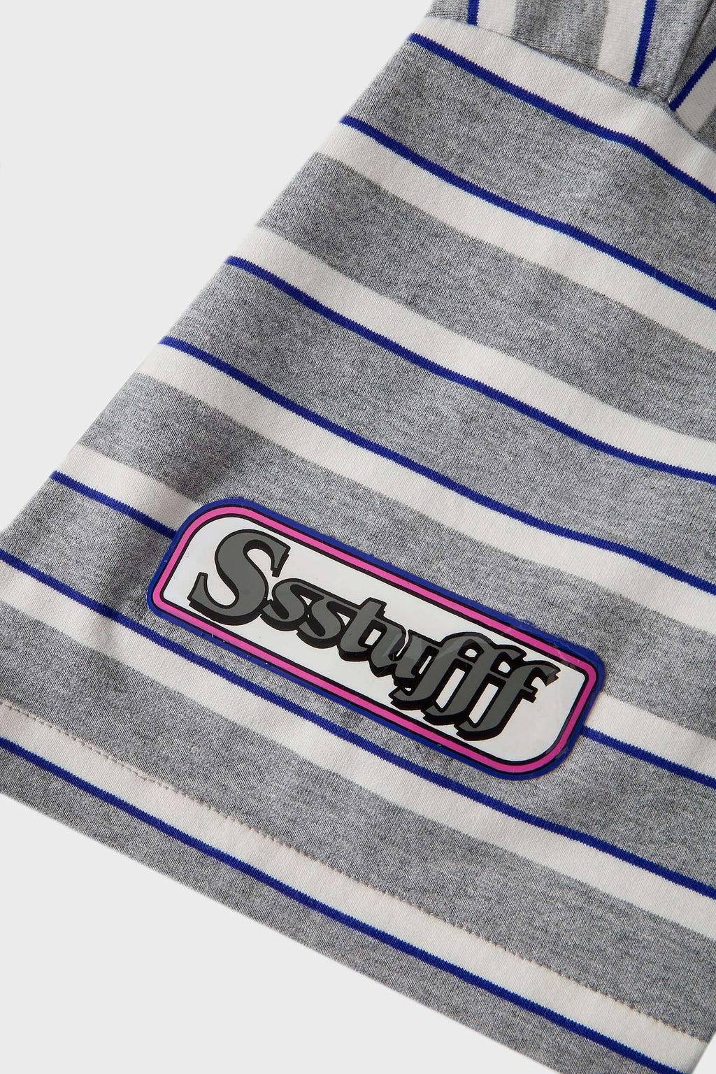 Grey striped polo shirt with embroidery, PVC, and screenprint graphics inspired by retro birthday party style