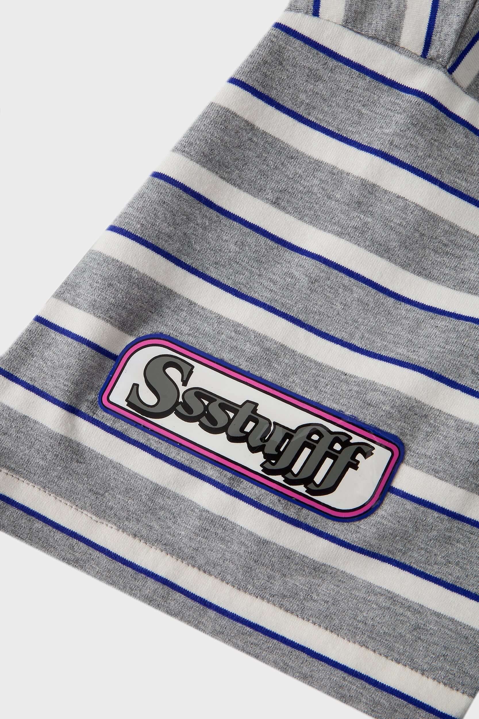 Grey striped polo shirt with embroidery, PVC, and screenprint graphics inspired by retro birthday party style