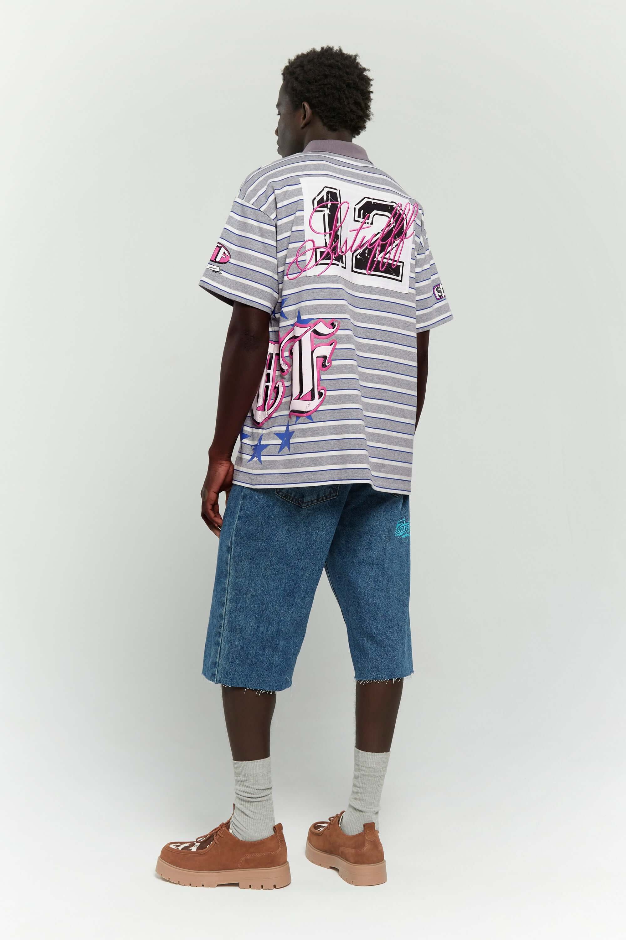Grey striped polo shirt with embroidery, PVC, and screenprint graphics inspired by retro birthday party style