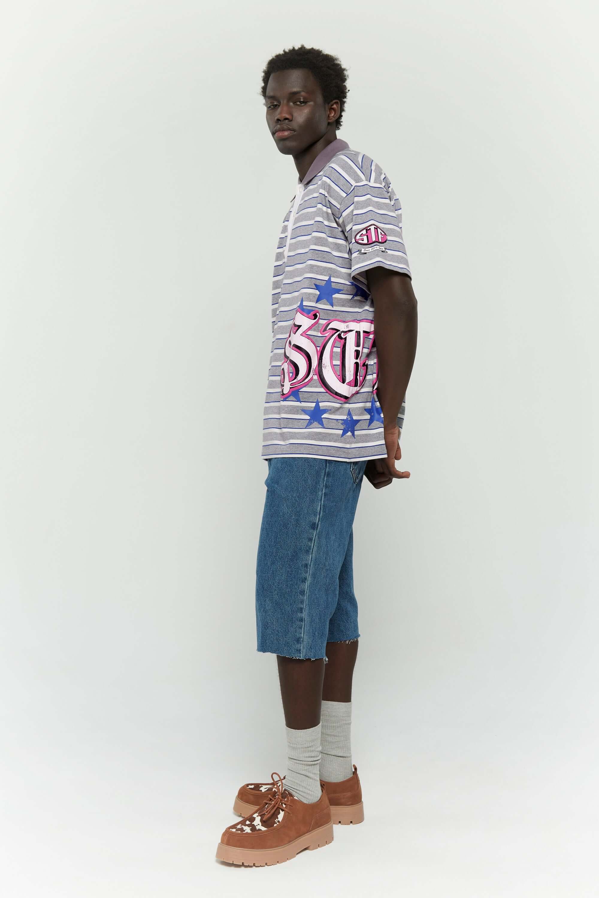 Grey striped polo shirt with embroidery, PVC, and screenprint graphics inspired by retro birthday party style