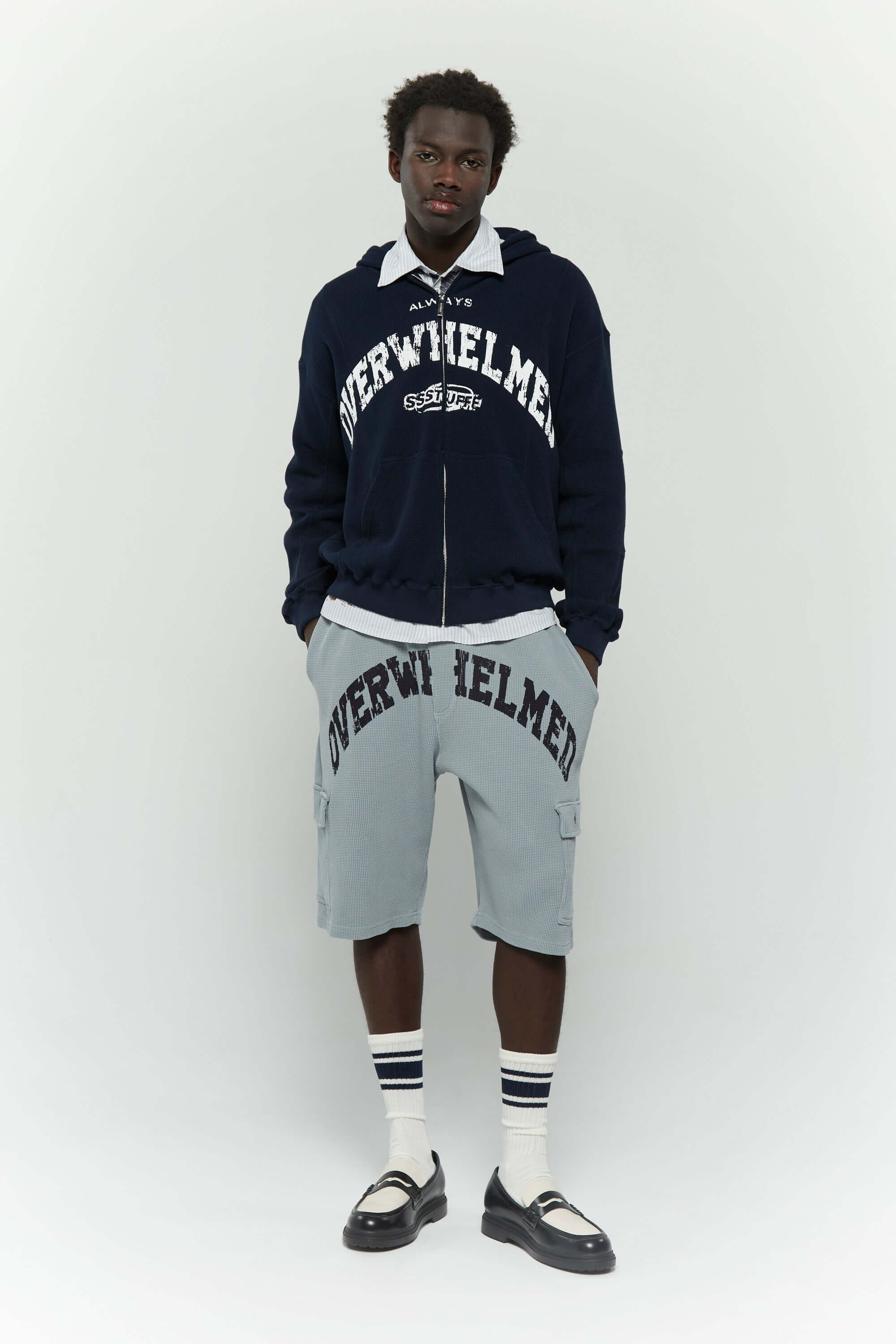 Grey waffle cotton cargo shorts with 'Always Overwhelmed' screenprint and collegiate-style design