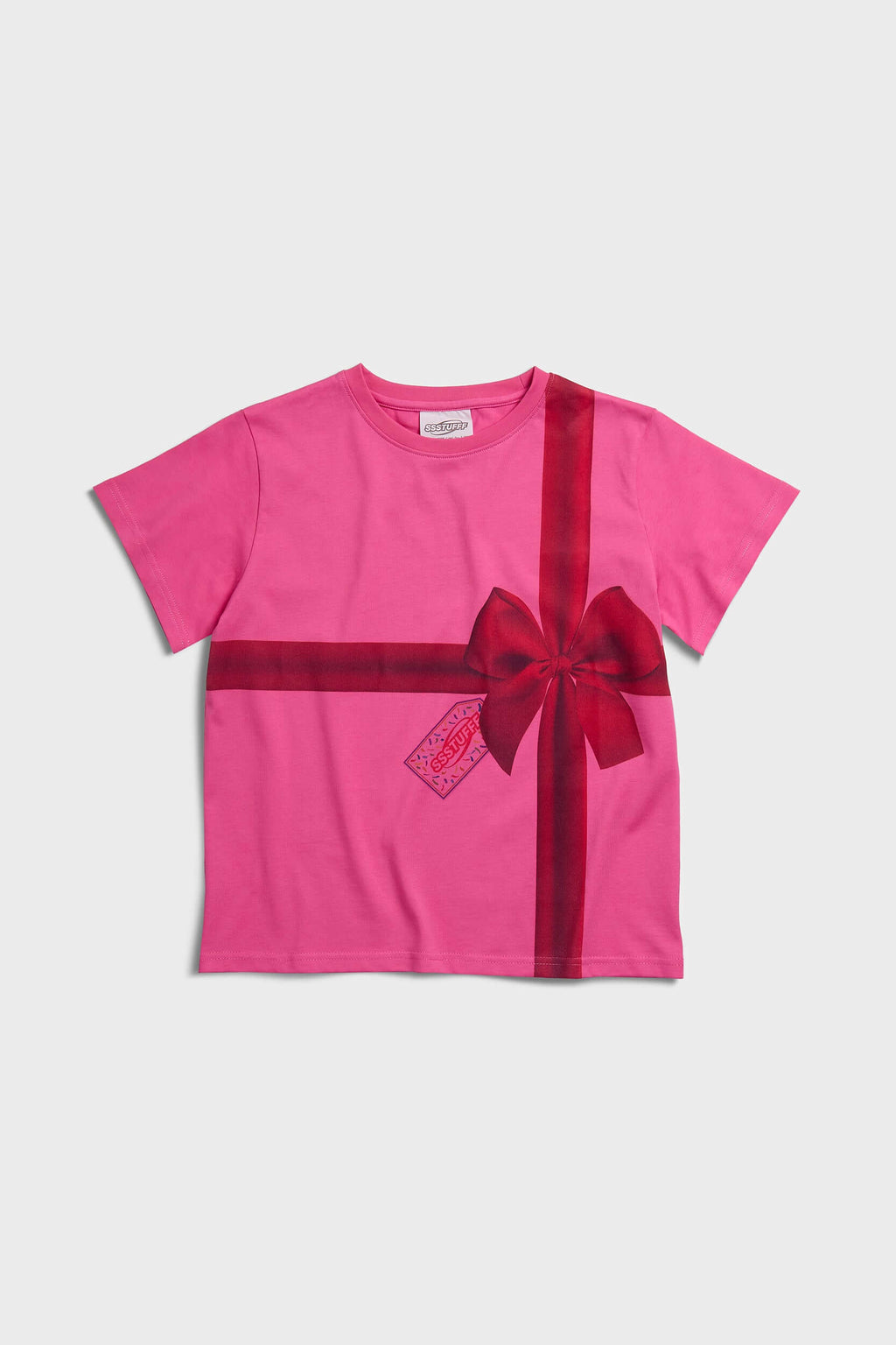 Pink t-shirt with a red ribbon graphic mimicking a present