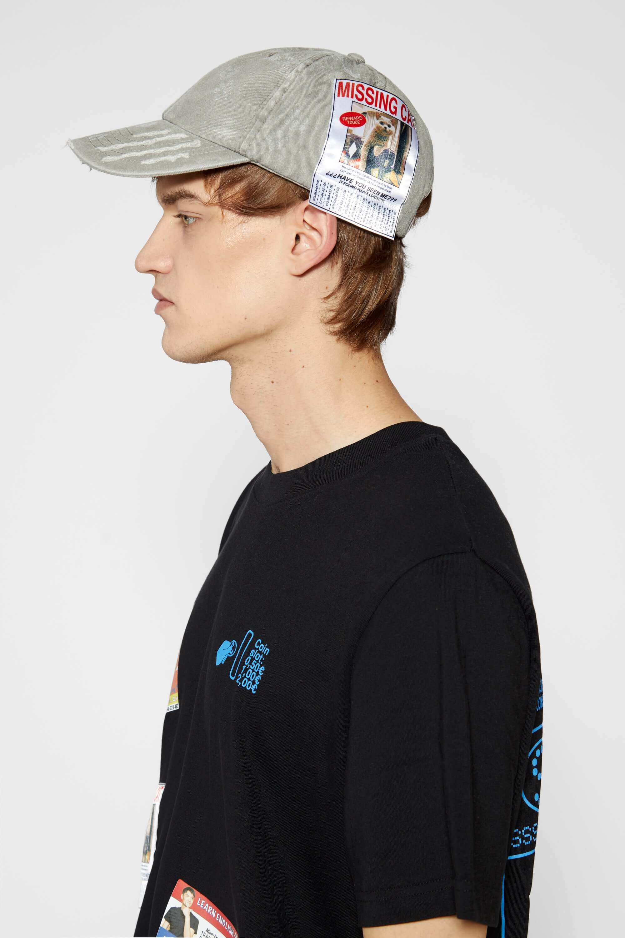 Light grey cotton cap with missing cat jacquard patch and handcrafted cat scratches and footprints